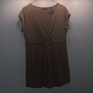 Brown stretchy blouse with deep cut and gold belt